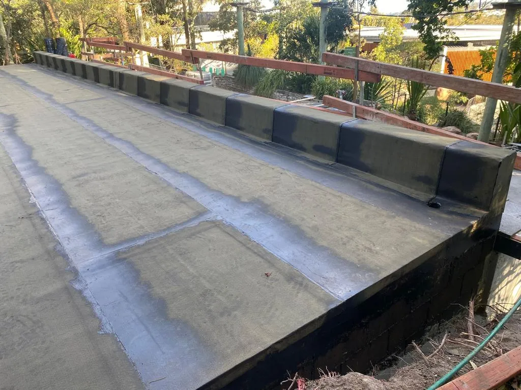 Newly sealed deck in an outdoor setting.