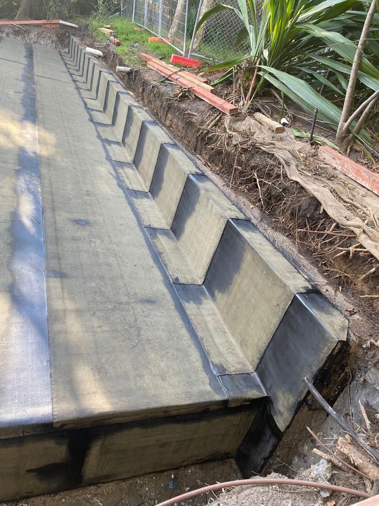 Concrete walls with insulation in construction site