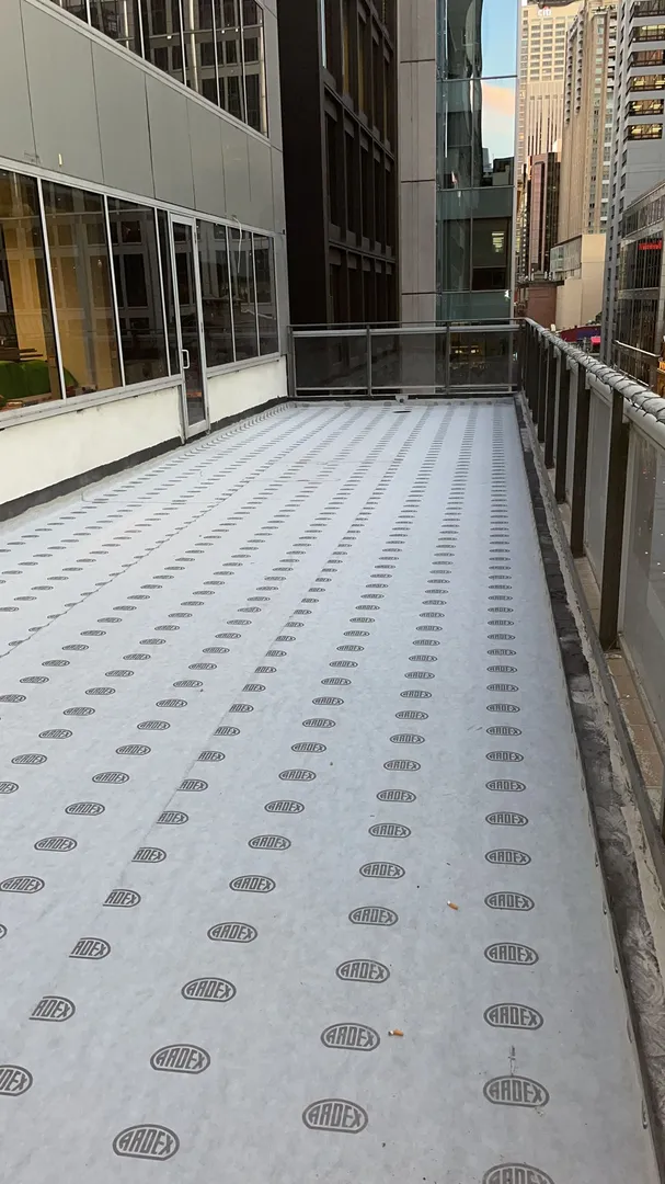 Rooftop deck with Ardex protective covering.