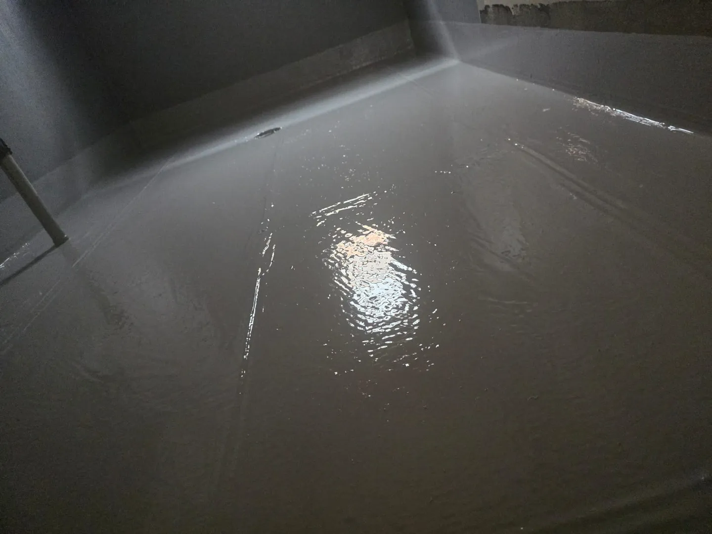 Freshly poured concrete floor setting.