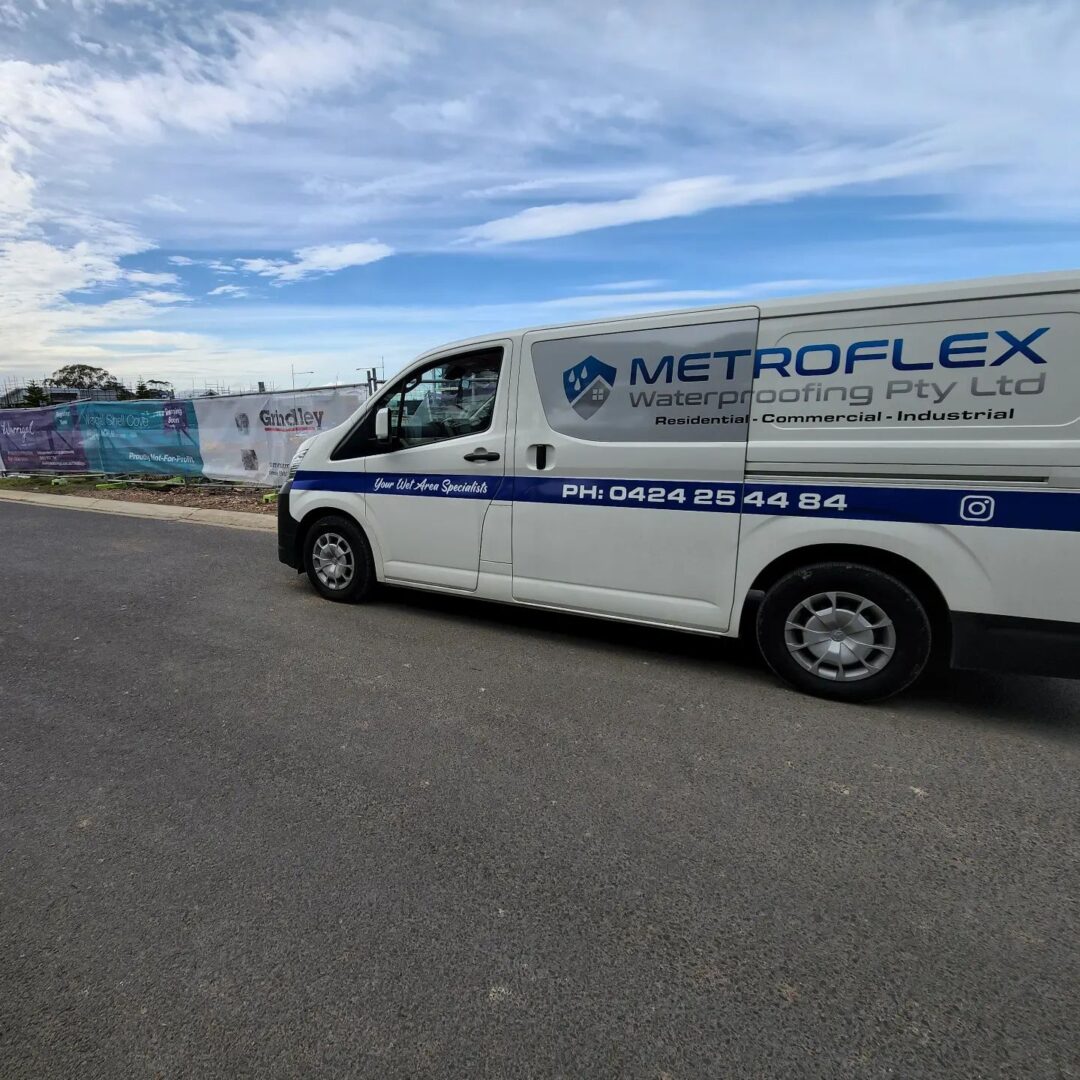 Metroflex Waterproofing van at construction site.