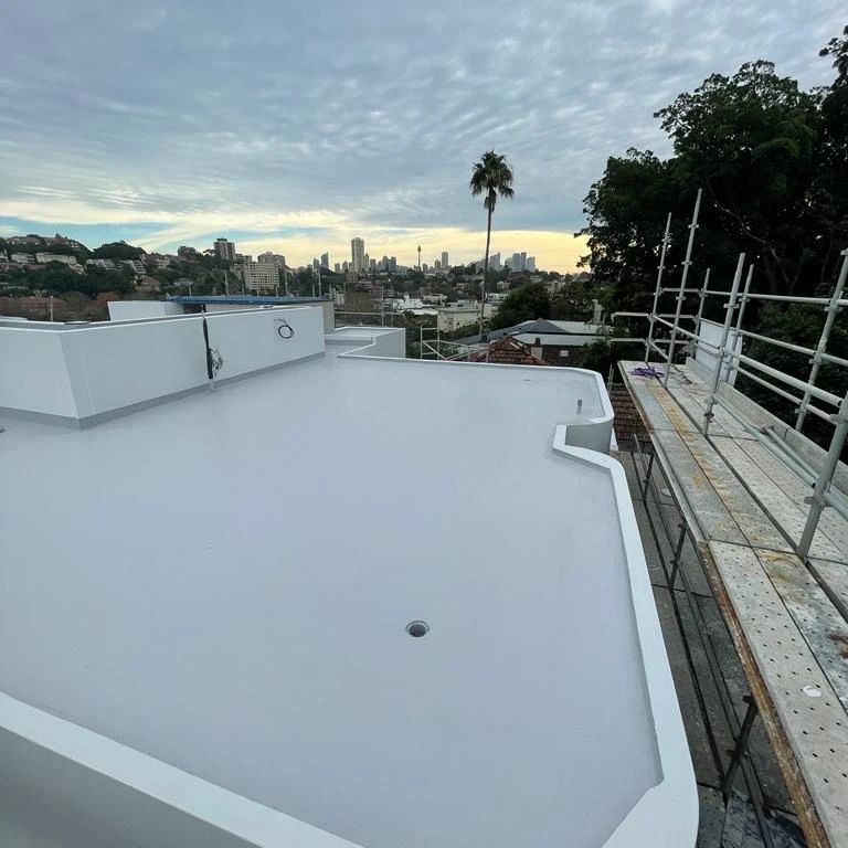 Rooftop view of city skyline and skyscrapers.